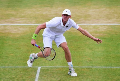 Kevin Anderson fires from the net against Gilles Simon.