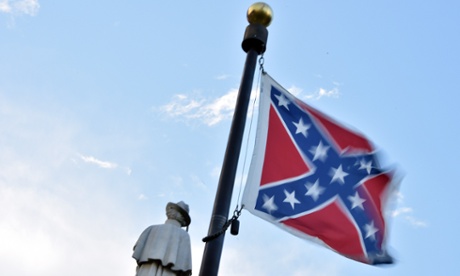 The Confederate flag flies next to a monument to victims of the civil war in Columbia.