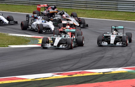Rosberg leads into the first corner ahead of Hamilton.