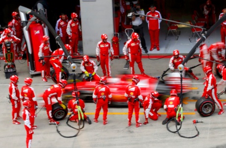 Vettel leaves the pits after a tyre change.