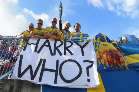 Sweden fans pose with a banner.