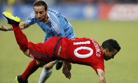 Sebastian Giovinco is tripped up by Pablo Alvarez
