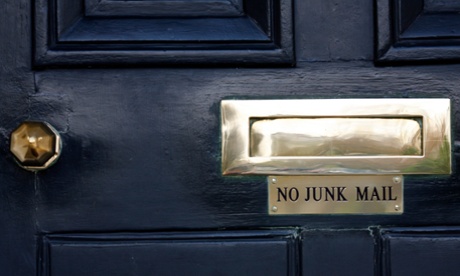 A sign saying No Junk Mail under a letterbox