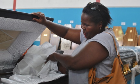 A Cape Town undertaker looks for a coffin for her client.