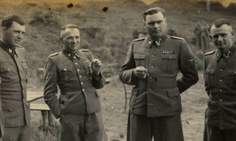 A1944 photo provided by the U.S. Holocaust Memorial Museum (USHMM) shows SS officers socializing on the grounds of the SS retreat, Solahutte outside of Auschwitz, Poland. From left, Dr Josef Mengele - dubbed the Angel of Death, alongside Rudolf Hess, Josef Kramer, and an unidentified officer.
