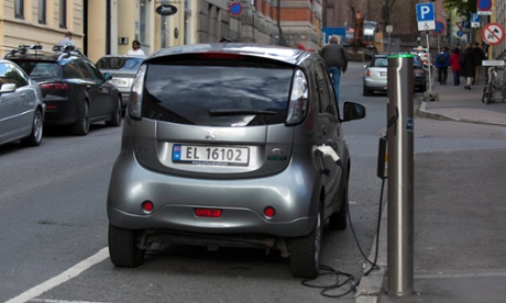 An electric car charges in Oslo