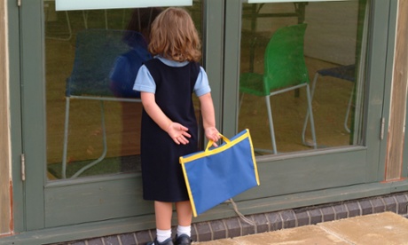 Child looking though school window