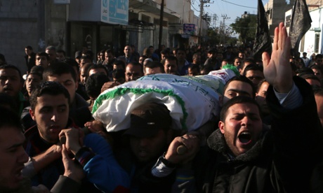 Palestinian mourners carry the body of   Tayseer al-Ismary, a Hamas militant,