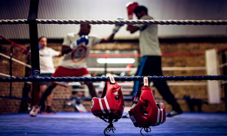 Head guards hang from the ropes as boxers spar at Fitzroy Lodge Boxing Club in Lambeth, London.