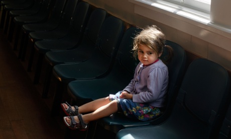 small girl sitting on chair