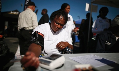 Bernita Jackson, 51, has her blood pressure measured at an event to inform people about the Affordable Care Act in Los Angeles, California, November 25, 2013.