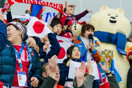 The white bear mascot  'doing' the crowd at the speed skating