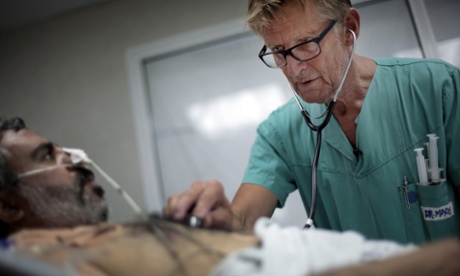 Gilbert treats a man in the emergency room