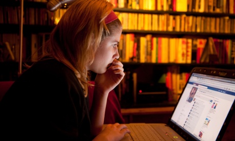 Teenage girl looking at Facebook