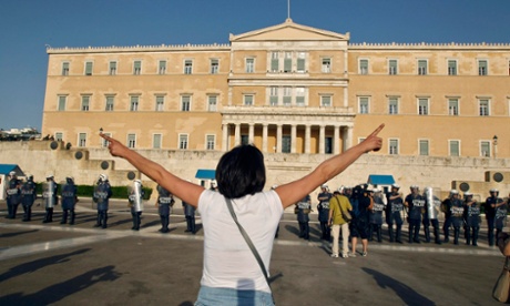 Athenians gather in front of the Greek parliament in protests at politicians’ approval of austerity measures.