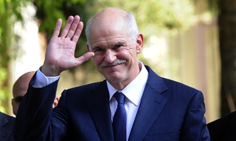 Outgoing Greek Prime Minister George Papandreou waves while leaving the Greek Presidential palace in Athens.