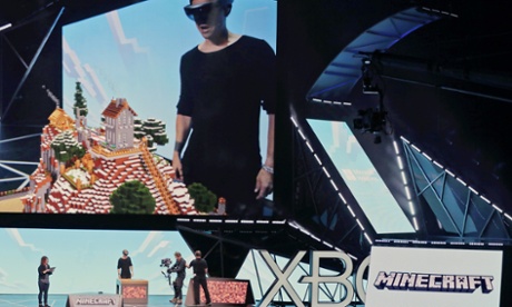 Microsoft Studios executive Saxs Persson demonstrates how the HoloLens is used to play Minecraft at E3 2015.