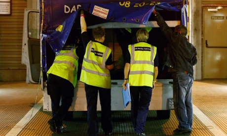 UK Border Agency staff in Calais check lorries bound for the UK for immigrants hiding within them.