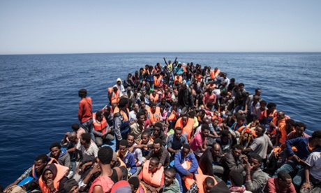 Hundreds of migrants on a ship in the Mediterranean off the coast of Libya, encountered by the privately funded rescue foundation Moas.