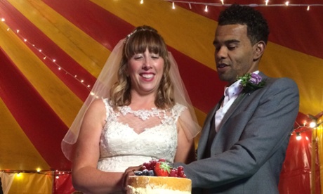 Jenni and Andrew at their wedding reception in a circus tent.