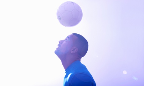 A footballer heading a ball