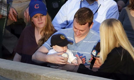 Keith Hartley is interviewed by a television reporter after he caught the foul ball
