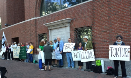 Demonstrators against the death penalty stand outside the US District Court in Boston as Dzhokhar Tsarnaev awaits his official sentence of death on 24 June  2015.