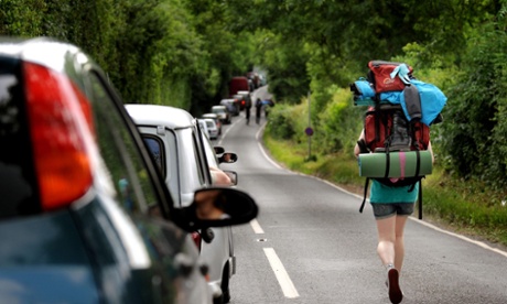 Not stuck in the middle … A walker avoids the jams at Glastonbury in 2009.