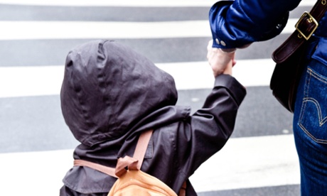 mother and child on zebra crossing