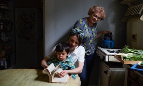 olia hercules and family sitting at a table in their kitchen