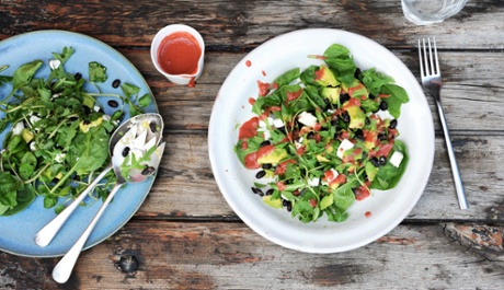 Raspberry dressing spruces up a mixed salad of avocado and rocket