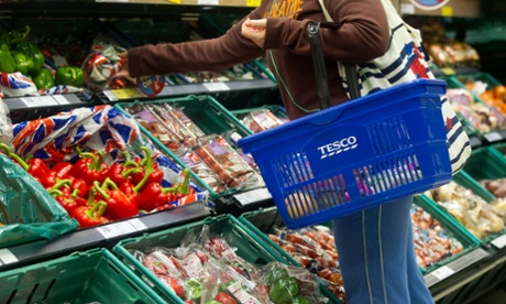 shopper in tesco with basket
