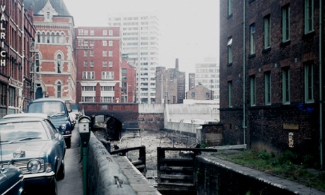 Views of the Rochdale Canal including a building at the entrance to a  car park and the disused canal and locks Date May 1974