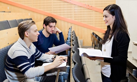 University students discussing paperwork