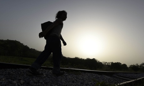 New dawn … a migrant walks beside a railway line in Chamcamax in Mexico's Chiapas state. The sustainable development goals call for no one to be left behind.