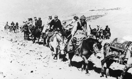 The 14th Dalai Lama (third from right on white pony) flees from Tibet to India, 1959. 