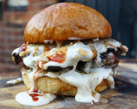 The Original Patty Men say their Tony Soprano's Wet Dream burger contains 'garlic mushrooms, peppered salami crisps, Alabama White sauce, sweet opm bbq sauce, pork scratching crumbs & smoked cheese sauce,with a 5 week aged longhorn beef 4 cut blend patty'.