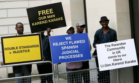 Protesters outside Westminster magistrates court demanding the release of Rwanda's spy chief, Karenzi Karake, on 25 June 2015.