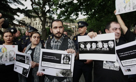 Demonstrators protesting against Azerbaijan human rights abuses in Tbilisi, Georgia, part of rallies organised in cities around the world ahead of the opening ceremony.