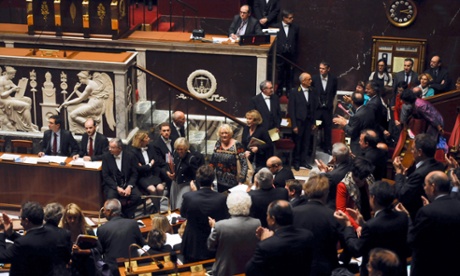 At the National Assembly in Paris, female MPs of the socialist majority arrive late to a weekly session on 9 October 2013, to protest against sexist insults made to green party member Veronique Massonneau in parliament on the previous day.