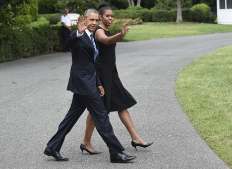President Barack Obama and first lady Michelle Obama walk to Marine One on the South Lawn of the White House in Washington, Friday, June 26, 2015. The Obama's are traveling to Charleston, S.C., where the President will eulogize the Rev. Clementa Pinckney and eight other worshipers who were gunned down by a white man last week during a Bible study at an African-American church. (AP Photo/Susan Walsh)