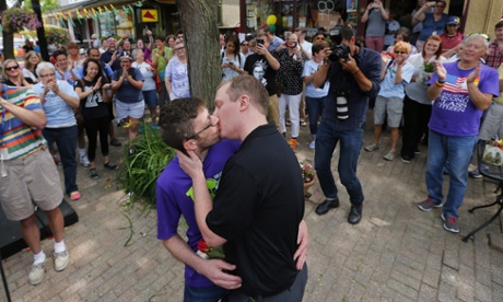 Derek Davis, left, and Chris Berghuis, both 36, of Ann Arbor, embrace after exchanging vows.