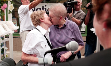 Marge Eide, left, 77, and Ann Sorrell, 78, a same-sex couple for more than forty years, are married by Washtenaw County Circuit Court Judge Carol Kuhnke on 26 June in Ann Arbor, Michigan.