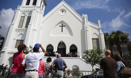 People look on as mourners file into the funeral of Cynthia Hurd, 54, at the Emanuel African Methodist Episcopal Church where she was killed.