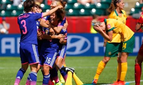Iwabuchi (#16) is mobbed by teammates after her late goal . (Photo by Kevin C. Cox/Getty Images)