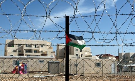 Palestinian flag on a barbed wire fence outside the Israeli settlement of Beitar Illit 