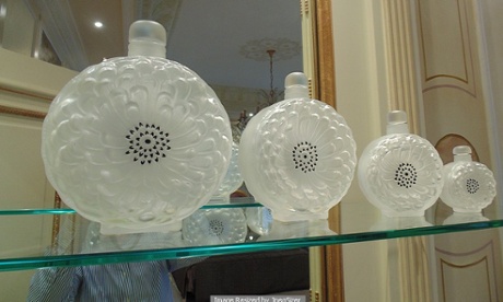 Going for a song: a set of four Lalique France Dahlia crystal perfume bottles.