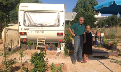 Georgios Karvouniaris and his sister Barbara outside their caravan