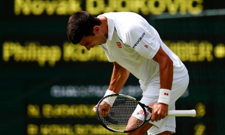 Defending champion Novak Djokovic celebrates winning the second set.