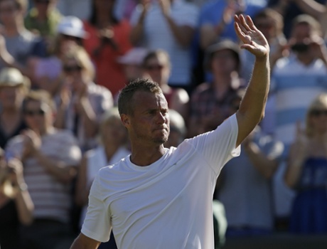 Lleyton Hewitt waves goodbye to Wimbledon.